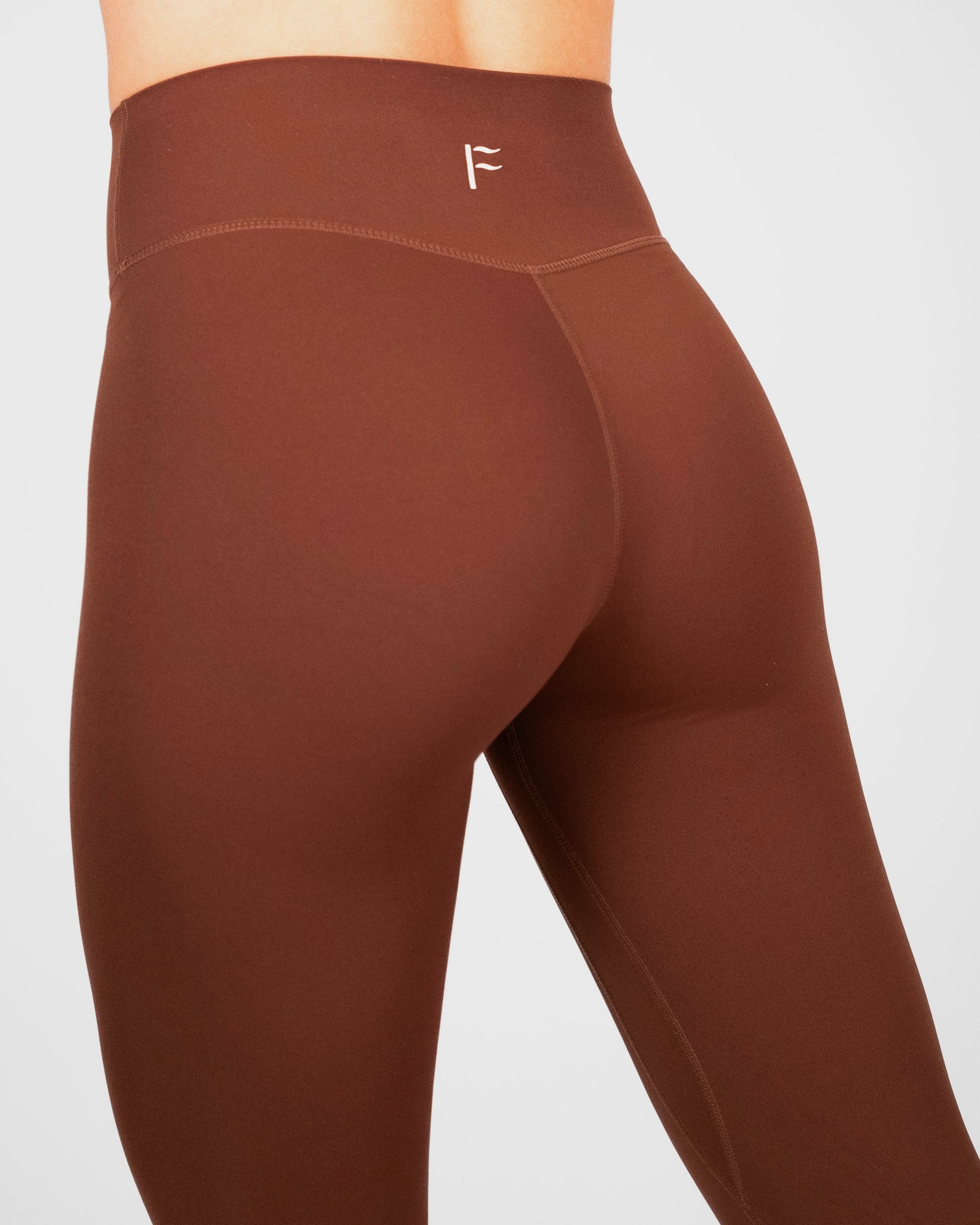 logo Fanatique dames sportlegging donkerbruin donkerbruine sportlegging dames squatproof sportlegging dames squat proof Fanatique Sportswear